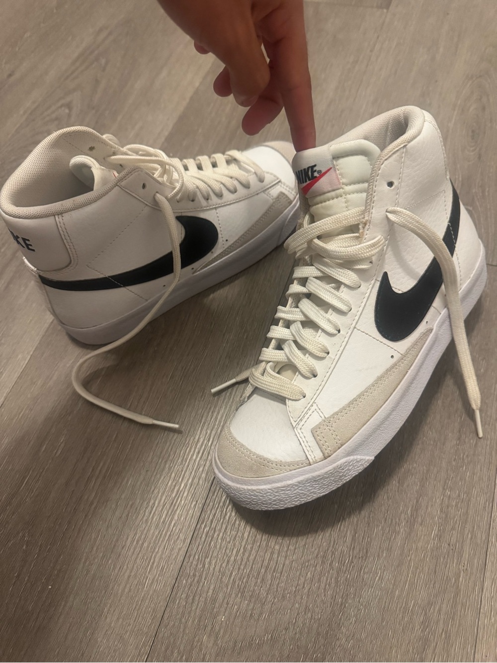 Nike Women's White High-Top Sneakers with Black Swoosh